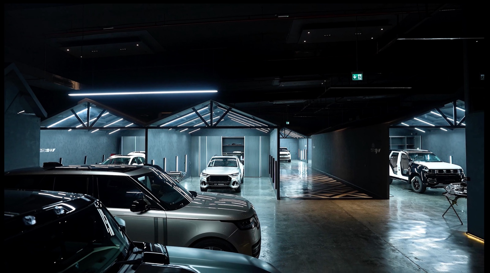 Row of fleet vehicles undergoing scheduled maintenance at Auto Millennium